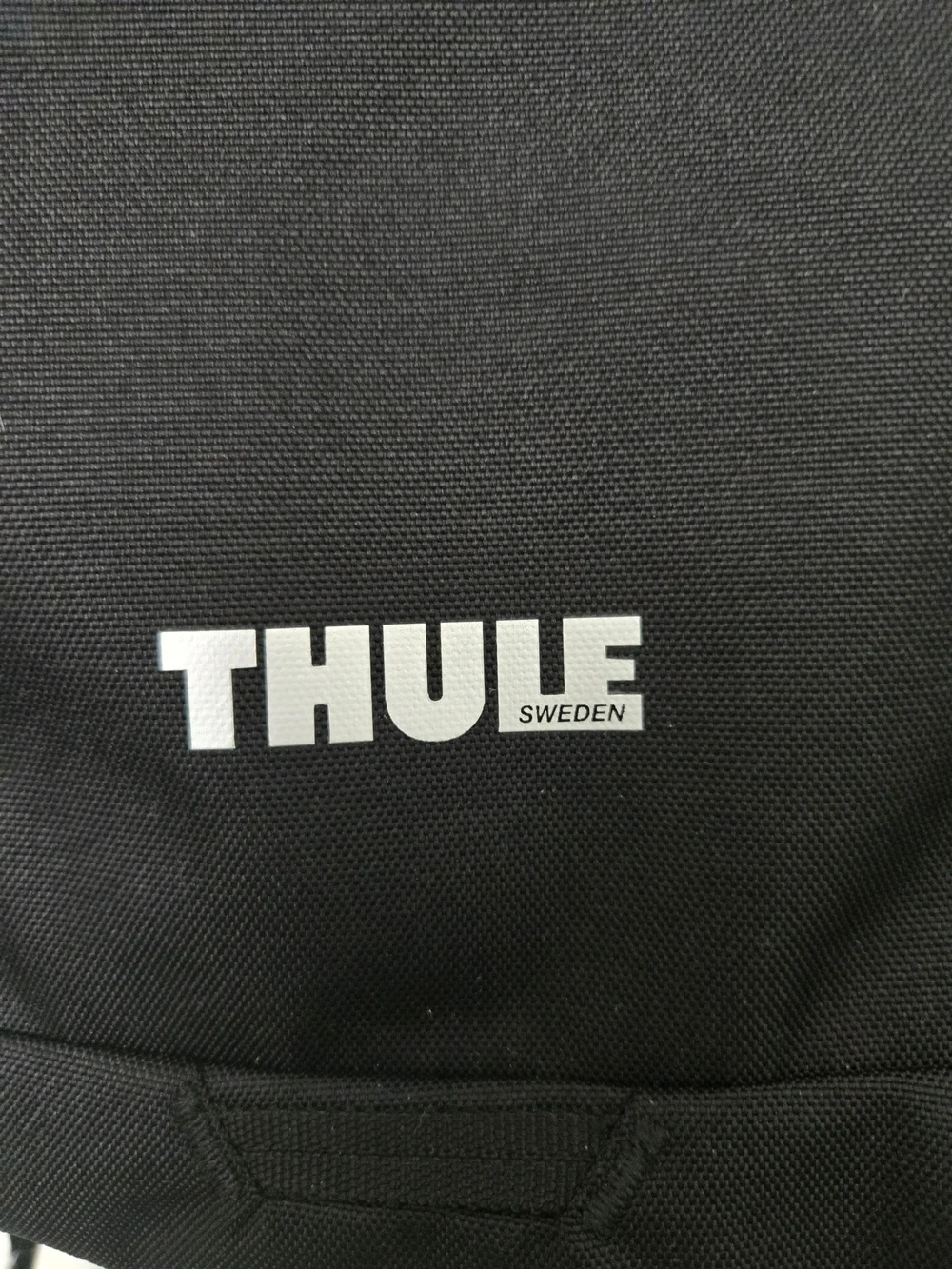 Thule Black Backpack with Innoviva Specialty Therapeutics Logo